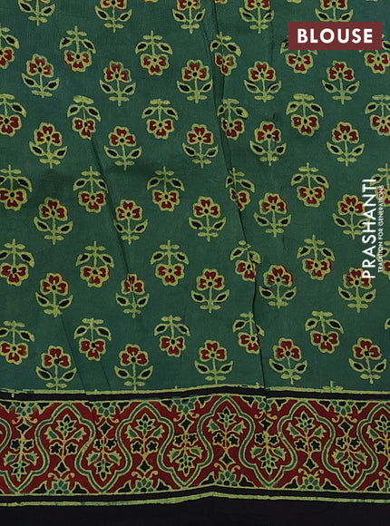 Dola silk saree green shade with allover ajrakh prints and zari woven border