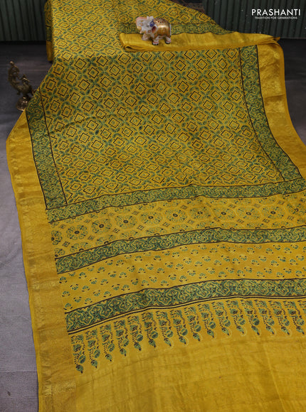 Dola silk saree yellow with allover ajrakh prints and zari woven border
