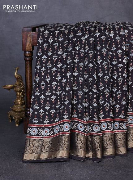 Dola silk saree black and maroon with allover butta prints and zari woven border