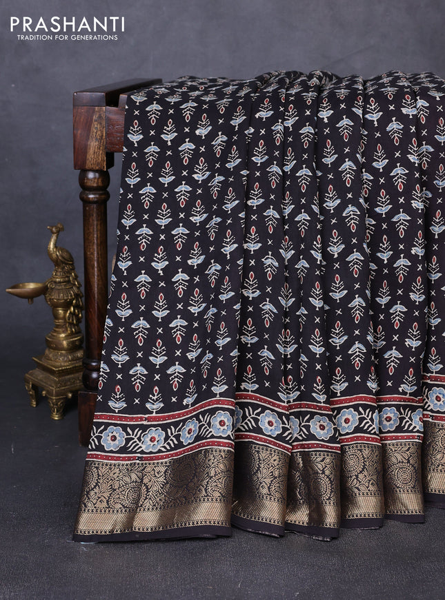 Dola silk saree black and maroon with allover butta prints and zari woven border