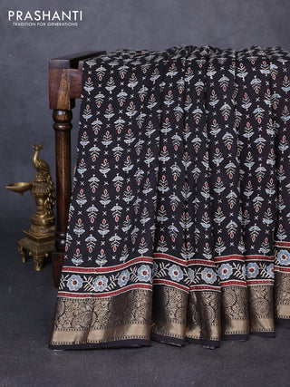 Dola silk saree black and maroon with allover butta prints and zari woven border