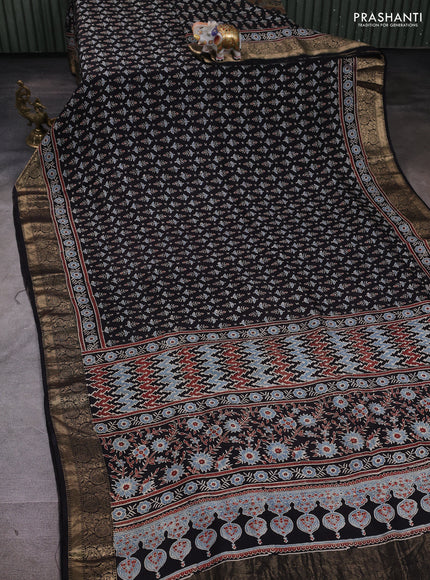 Dola silk saree black and maroon with allover butta prints and zari woven border