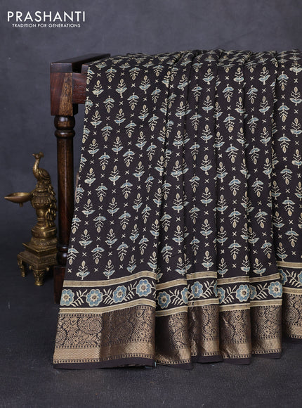 Dola silk saree black and blue shade with allover butta prints and zari woven border