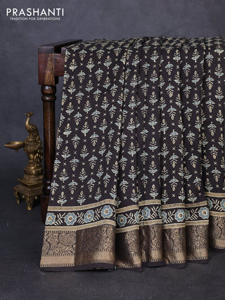 Dola silk saree black and blue shade with allover butta prints and zari woven border