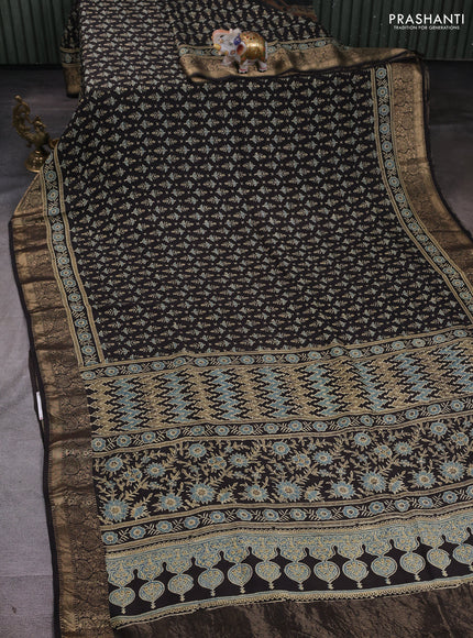 Dola silk saree black and blue shade with allover butta prints and zari woven border