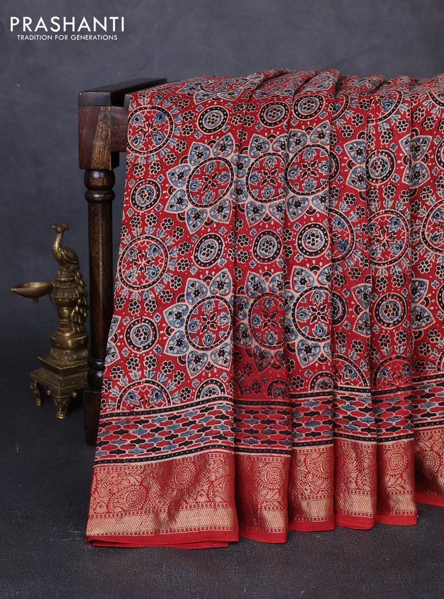 Dola silk saree maroon with allover ajrakh prints and zari woven border