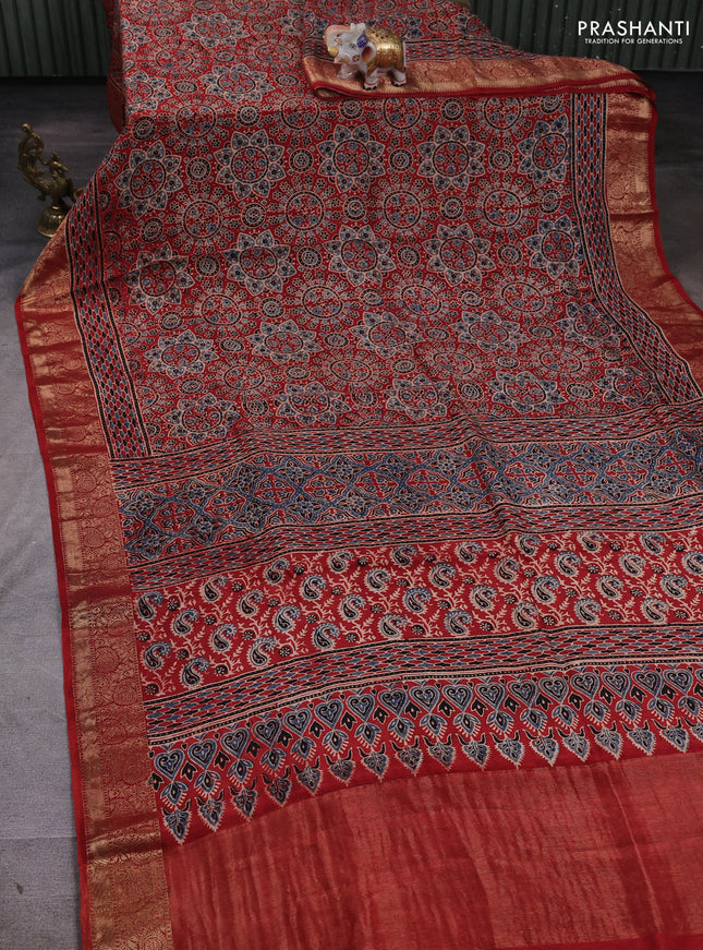 Dola silk saree maroon with allover ajrakh prints and zari woven border