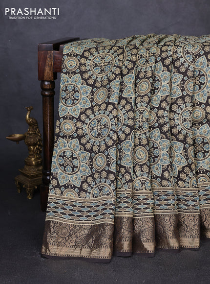 Dola silk saree coffee brown with allover ajrakh prints and zari woven border