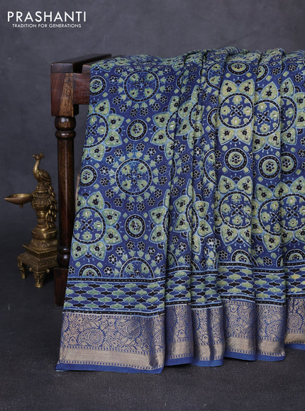 Dola silk saree indigo blue with allover ajrakh prints and zari woven border