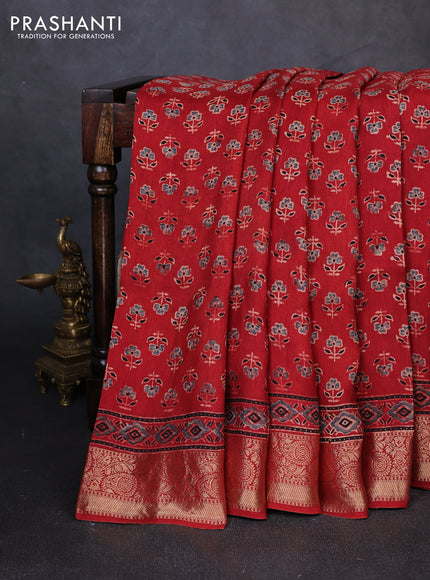 Dola silk saree maroon with allover butta prints and zari woven border