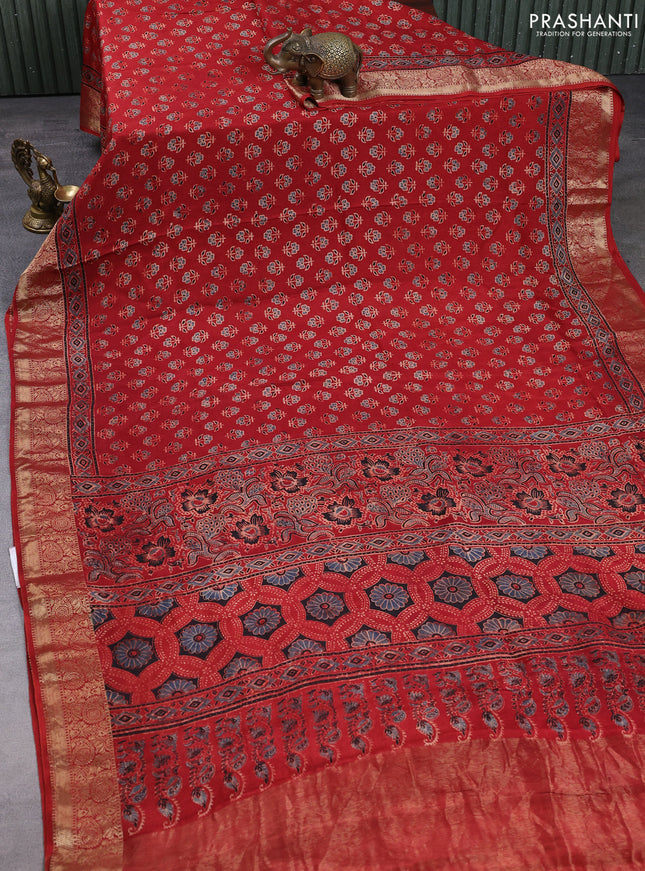 Dola silk saree maroon with allover butta prints and zari woven border