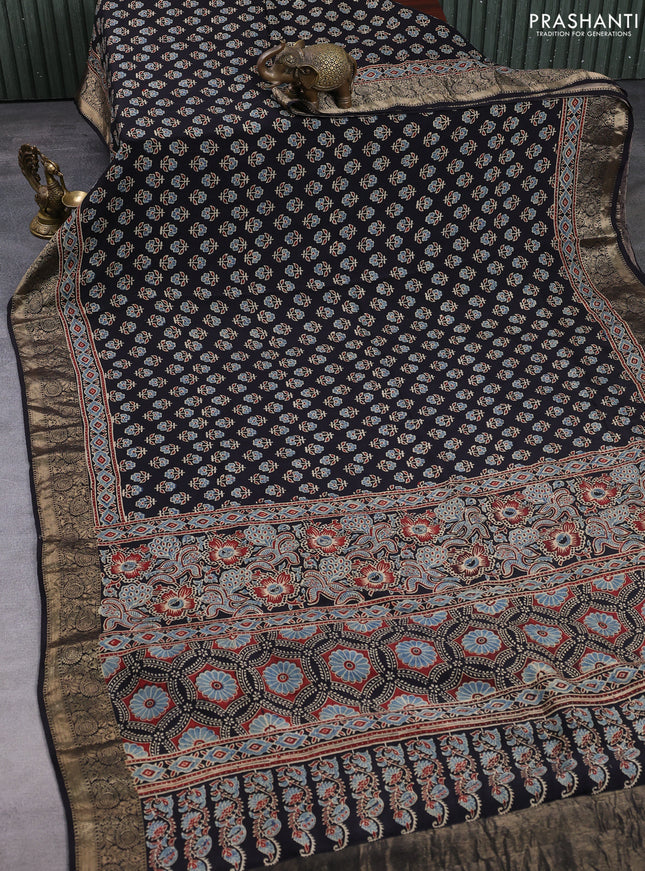 Dola silk saree black with allover butta prints and zari woven border