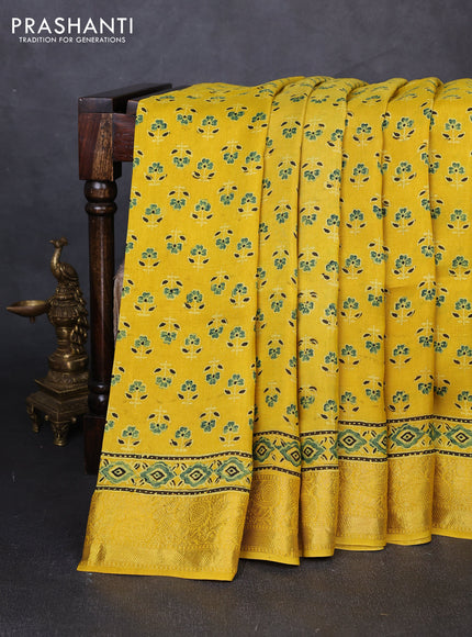 Dola silk saree yellow with allover butta prints and zari woven border