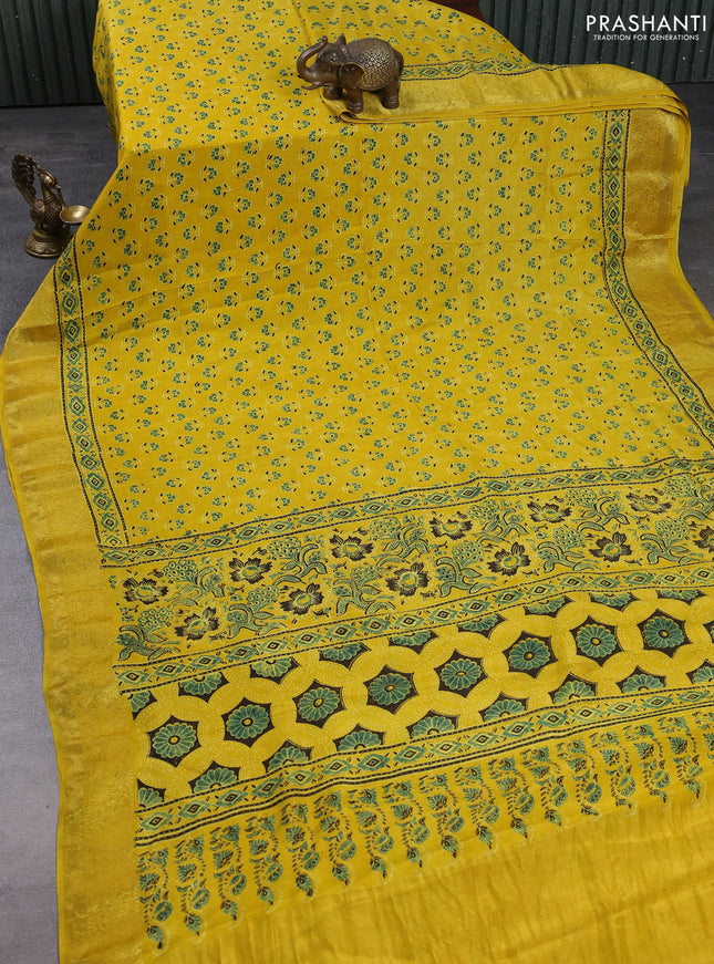 Dola silk saree yellow with allover butta prints and zari woven border