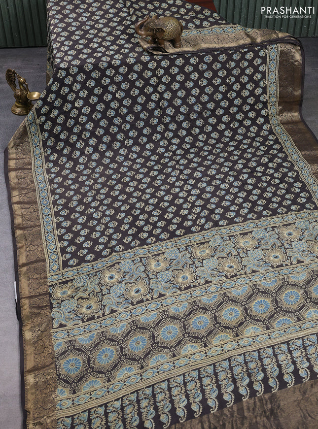 Dola silk saree blue shade and black with allover butta prints and zari woven border