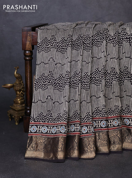 Dola silk saree indigo blue with allover ajrakh prints and zari woven border