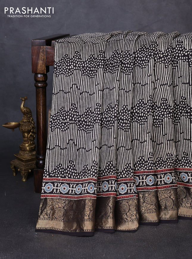 Dola silk saree indigo blue with allover ajrakh prints and zari woven border