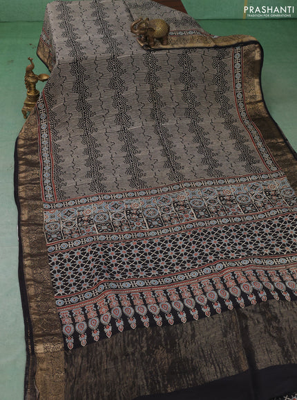 Dola silk saree indigo blue with allover ajrakh prints and zari woven border