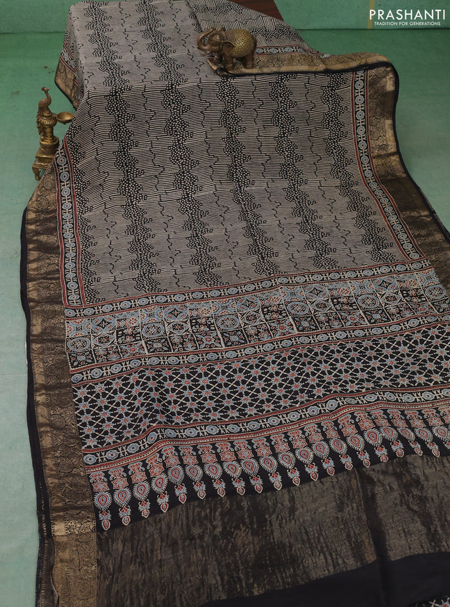 Dola silk saree indigo blue with allover ajrakh prints and zari woven border