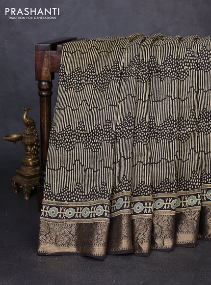 Dola silk saree blue shade with allover ajrakh prints and zari woven border