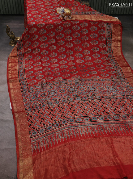 Dola silk saree maroon with allover ajrakh prints and zari woven border