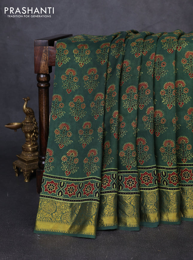 Dola silk saree green shade with allover ajrakh prints and zari woven border