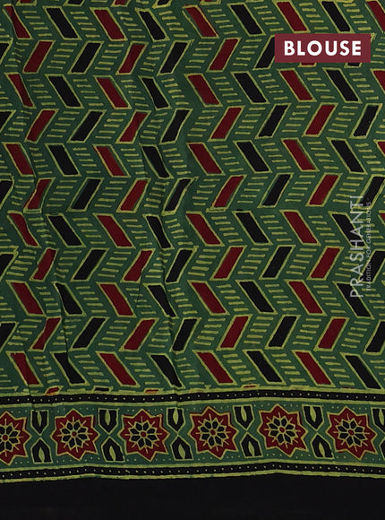 Dola silk saree green shade with allover ajrakh prints and zari woven border
