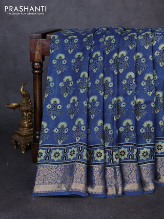 Dola silk saree indigo blue and blue shade with allover ajrakh prints and zari woven border