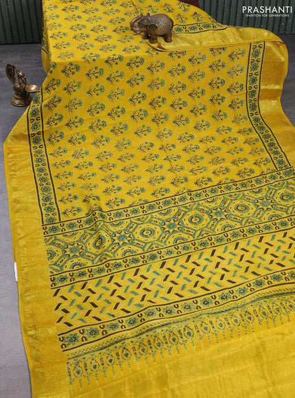 Dola silk saree yellow with allover ajrakh prints and zari woven border