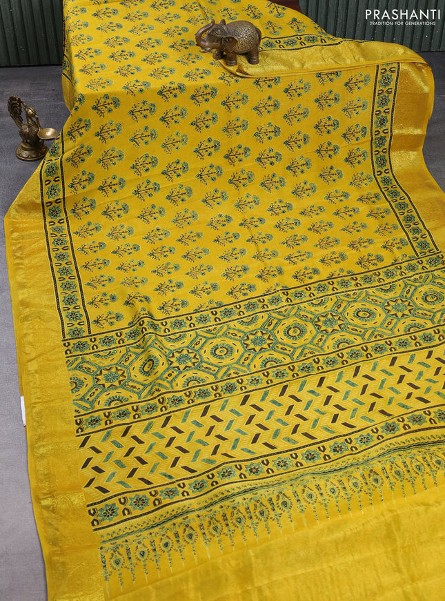 Dola silk saree yellow with allover ajrakh prints and zari woven border