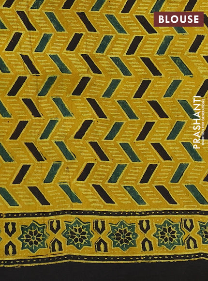 Dola silk saree yellow with allover ajrakh prints and zari woven border