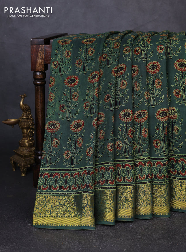 Dola silk saree green shade with allover ajrakh prints and zari woven border