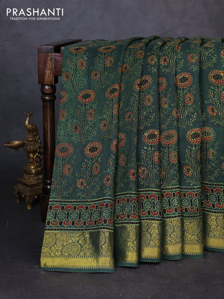 Dola silk saree green shade with allover ajrakh prints and zari woven border