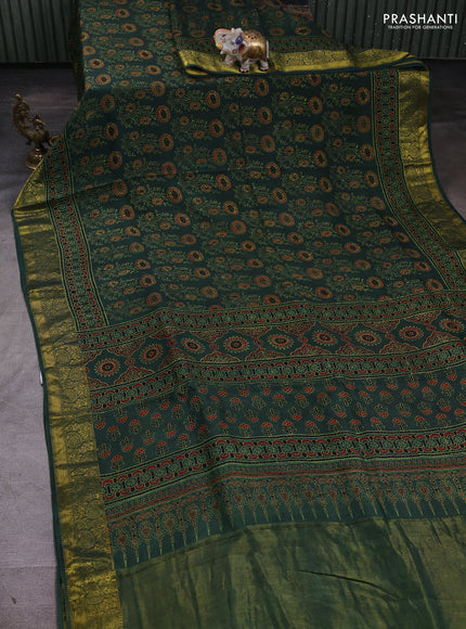 Dola silk saree green shade with allover ajrakh prints and zari woven border
