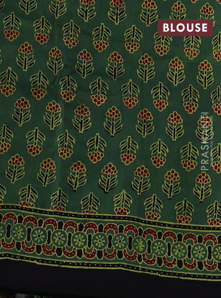 Dola silk saree green shade with allover ajrakh prints and zari woven border