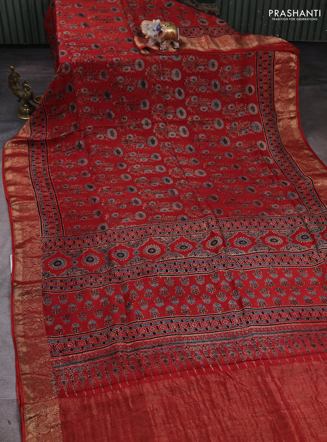 Dola silk saree maroon with allover ajrakh prints and zari woven border