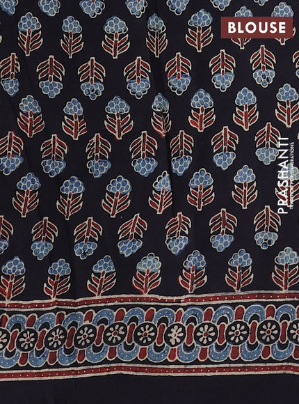 Dola silk saree black with allover ajrakh prints and zari woven border