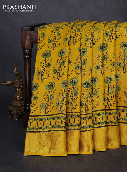 Dola silk saree yellow with allover ajrakh prints and zari woven border
