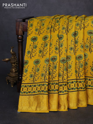 Dola silk saree yellow with allover ajrakh prints and zari woven border