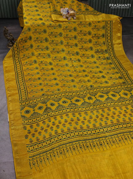 Dola silk saree yellow with allover ajrakh prints and zari woven border