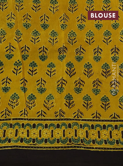 Dola silk saree yellow with allover ajrakh prints and zari woven border