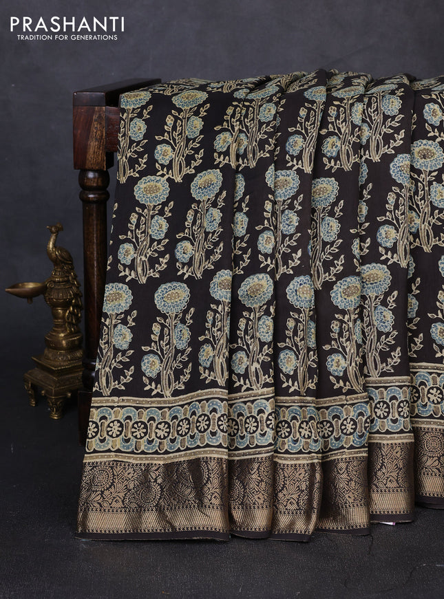 Dola silk saree black with allover ajrakh prints and zari woven border