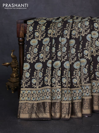 Dola silk saree black with allover ajrakh prints and zari woven border