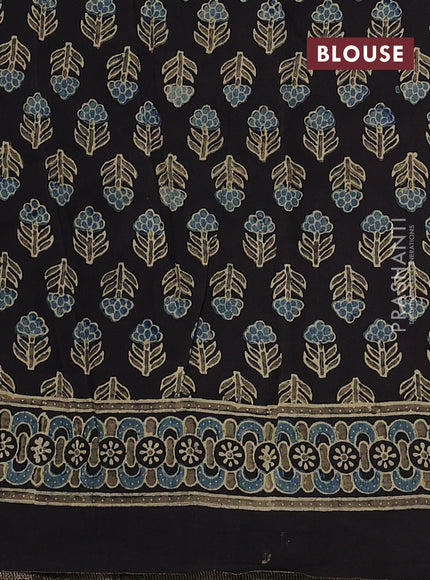Dola silk saree black with allover ajrakh prints and zari woven border