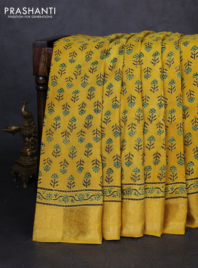 Dola silk saree yellow with allover floral butta prints and zari woven border