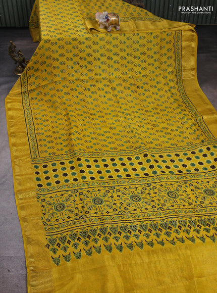 Dola silk saree yellow with allover floral butta prints and zari woven border