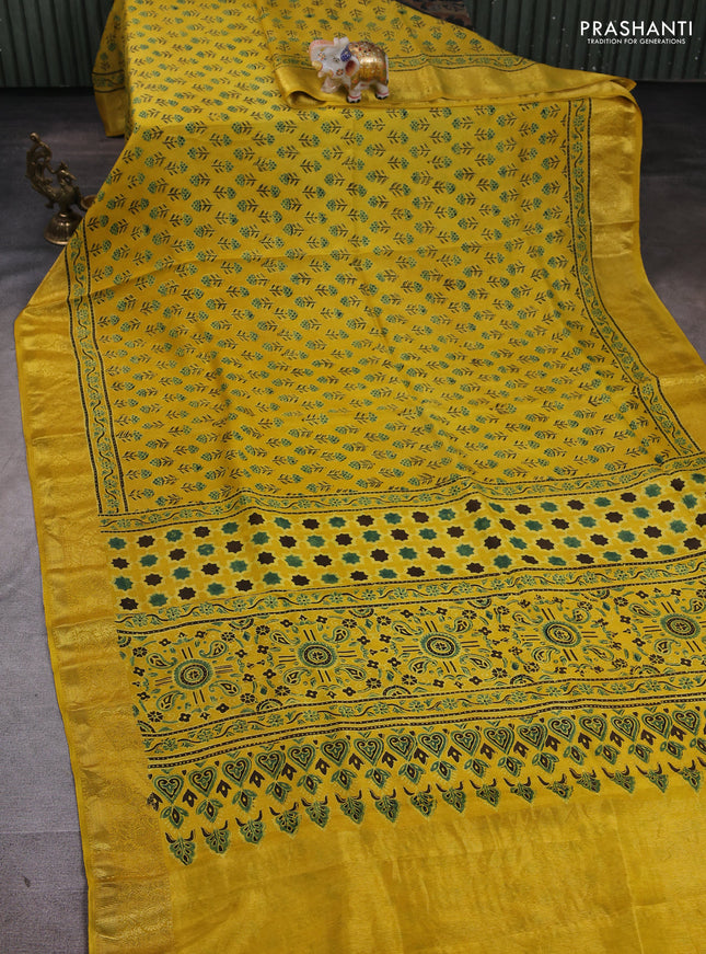 Dola silk saree yellow with allover floral butta prints and zari woven border