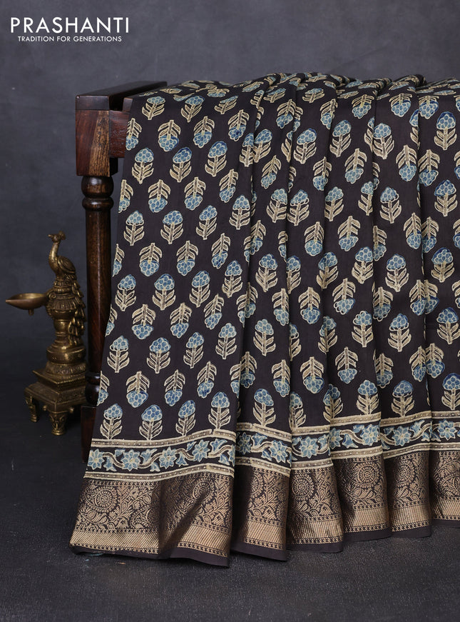 Dola silk saree black with allover floral butta prints and zari woven border