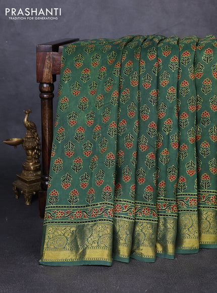 Dola silk saree green with allover floral butta prints and zari woven border