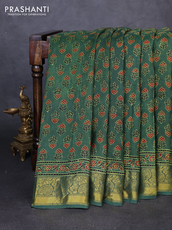 Dola silk saree green with allover floral butta prints and zari woven border